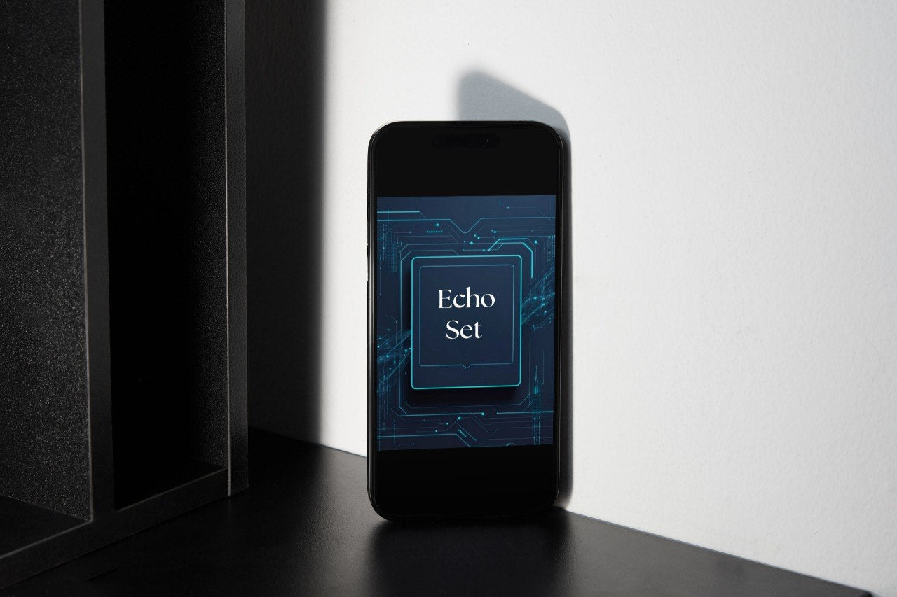 A black smartphone standing upright on a dark surface against a white wall, with its screen displaying the text 'Echo Set' over a blue circuit-board graphic.